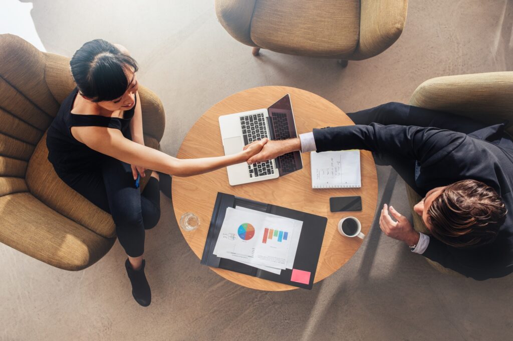 business colleagues shaking hands on deal.jpg